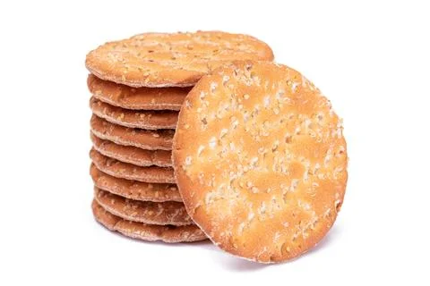 A Stack of Round Salt Crackers with Sesame Isolated on White Background Foto stock