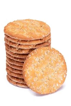 A Stack of Round Salt Crackers with Sesame Isolated on White Background Stockfoto's