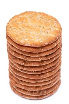 A Stack of Round Salt Crackers with Sesame Isolated on White Background Stock Photos