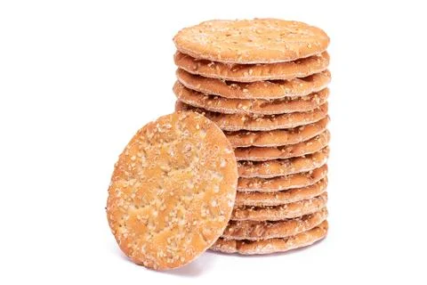 A Stack of Round Salt Crackers with Sesame Isolated on White Background Stock-Fotos