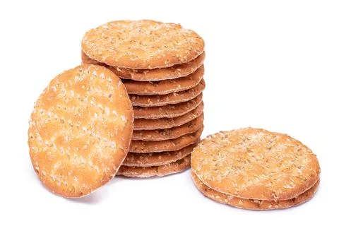 A Stack of Round Salt Crackers with Sesame Isolated on White Background Stockfoto's