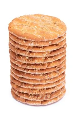 A Stack of Round Salt Crackers with Sesame Isolated on White Background Stockfoto's