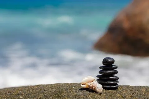 Stack of round smooth stones on a seashore Stock Photos