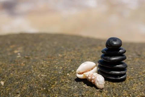 Stack of round smooth stones on a seashore Stock Photos