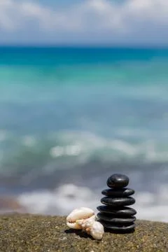 Stack of round smooth stones on a seashore Stock Photos