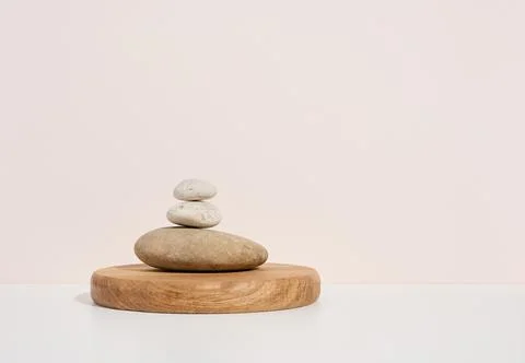 Stack of round stones on a white background. Scene for demonstration of cosme Stockfoto's
