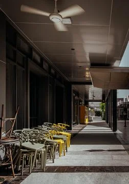 Stack of Round table and Dark green (Khaki color), Yellow plastic chairs ar.. Stock-Fotos
