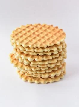A stack round waffles isolated over white background. Stock Photos