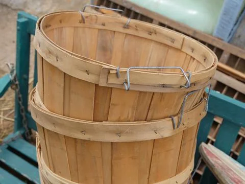 Stack of round wooden bins sold at a flea market Stock-Fotos