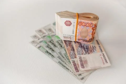 Stack of Russian Rubles on a Light Surface With Different Denominations Stock Photos