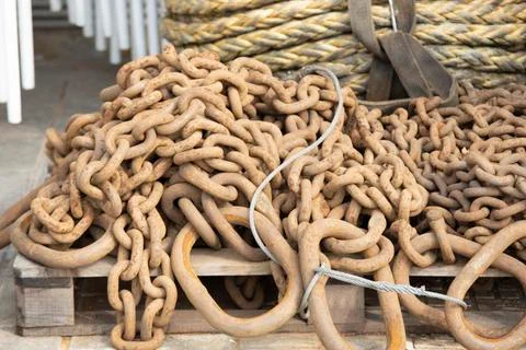 Stack of rusty chains close-up. They use industry and maritime. Close up. Stock Photos