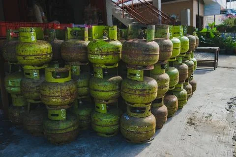 Stack of Rusty Green LPG Gas Cylinders Stock Photos