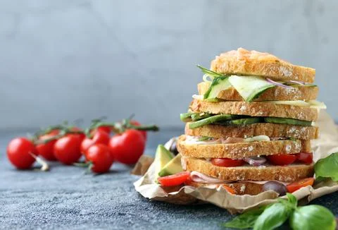 Stack of sandwiches with different fillings on the table Stock Photos