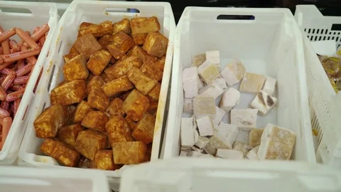 Stack of sausages and salted lard in food storage and shipping containers 스톡 동영상 84995536