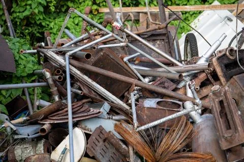 Stack of scrap metal, rusty pipes and wires outdoors. Recycling and garbage Stock Photos
