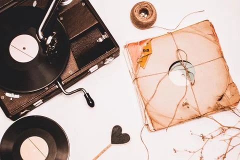 Stack of scratched dusty old vinyl records tied with rope Stock Photos