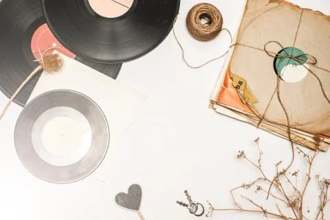 Stack of scratched dusty old vinyl records tied with rope Stock Photos