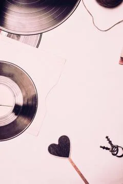 Stack of scratched dusty old vinyl records tied with rope Stock Photos