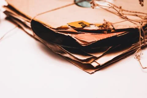 Stack of scratched dusty old vinyl records tied with rope Stock Photos