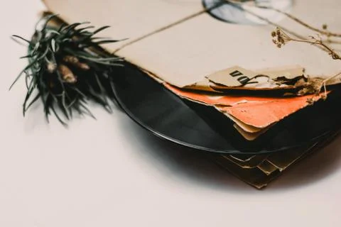 Stack of scratched dusty old vinyl records tied with rope Stock Photos