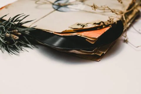 Stack of scratched dusty old vinyl records tied with rope Stock Photos