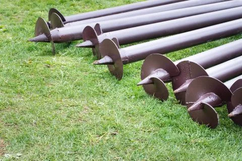 Stack of screw piles for house foundation, closeup. Outdoors on construction  写真素材