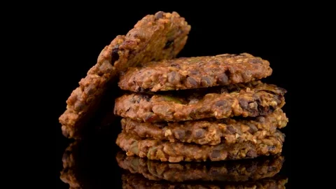 Stack of Seed and Chocolate Chip Cookies Rotating on Dark Background Stock Footage 330514641