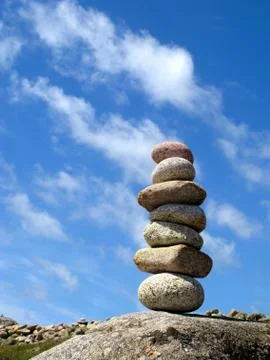 A stack of seven balanced stones. Photos