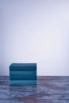 A stack of several books in fabric textured covers in a beautiful emerald col Stock Photos