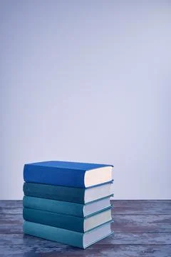 A stack of several books in fabric textured covers in beautiful emerald and.. Stock Photos