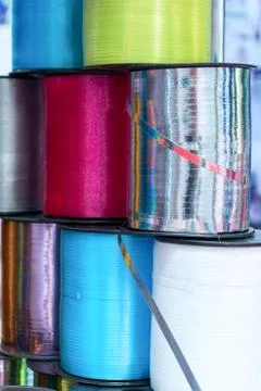 A stack of several coils with a multi-colored ribbon Stock Photos