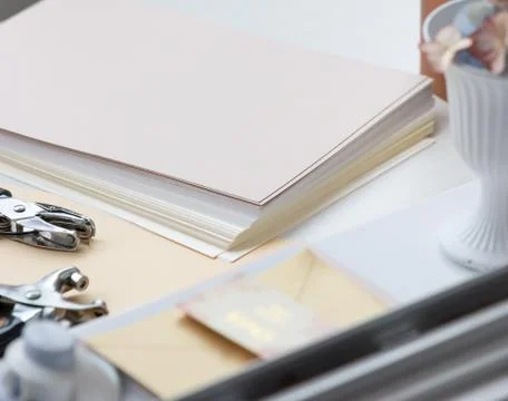 A stack of sheets for making envelopes. Workplace close-up. 写真素材