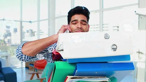 Stack shifting causing worker holding binders on phone business overlay linking Stock Footage 333318284