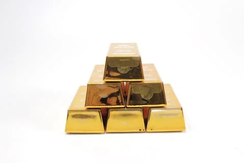 A Stack of shining gold bars isolated on white Stock Photos