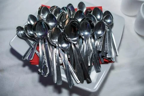 Stack of shining spoon, Abstract background of sparkling bronze spoon, kitchen Stock Photos