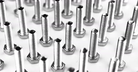 Stack of shiny bolts rotating on a white background Stock Footage 107347094
