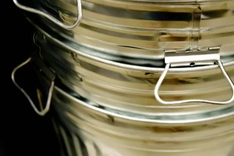 Stack of shiny new steel garbage cans Foto stock