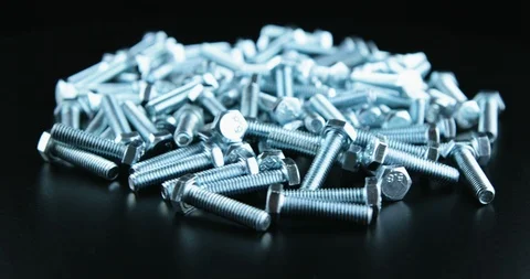 Stack of shiny nuts rotating on a black background 스톡 동영상 106976837