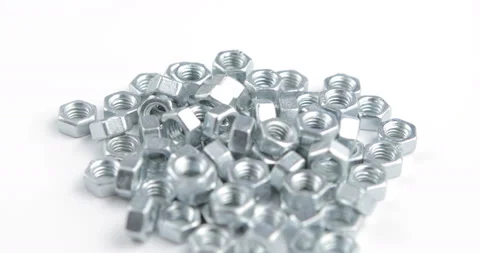 Stack of shiny nuts rotating on a white background Stock Footage 97920080