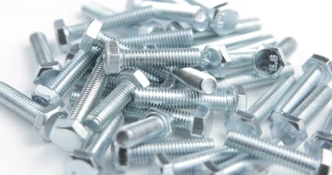Stack of shiny screw, bolt or stud rotating on a white background Stock Footage 97920405
