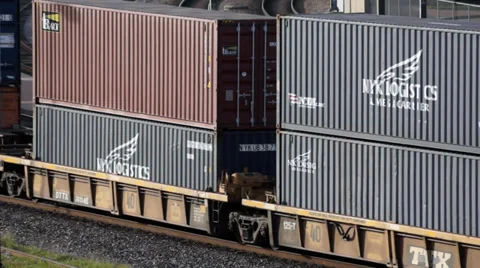 Stack Of shipping Containers on a train Stock Footage 37620366
