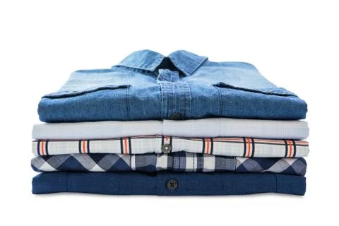 Stack of shirts isolated on white background Stock Photos