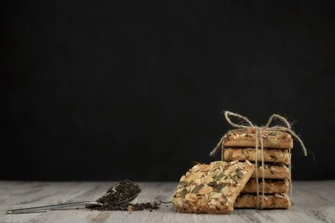 A stack of shortbread cookies with different types of nuts to a delicious cof Foto stock