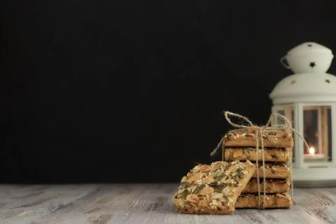 A stack of shortbread cookies with different types of nuts to a delicious cof Stock Photos
