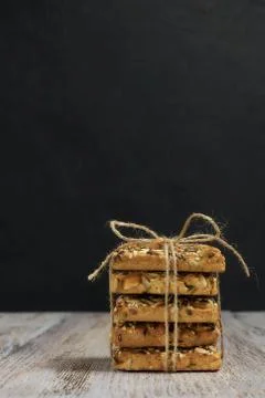 A stack of shortbread cookies with different types of nuts to a delicious cof Stock Photos