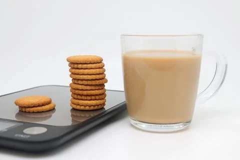A stack of shortbread cookies with raisins and cinnamon on the white plate an Stock Photos