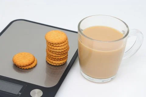 A stack of shortbread cookies with raisins and cinnamon on the white plate an Stock Photos