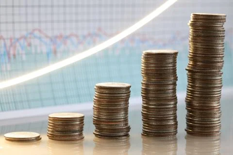 Stack of silver coins presentation at table going up Stock Photos