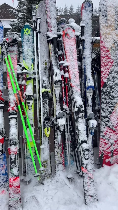 Stack of skis of skiers in a ski resort, parked during a coffee break Stock Footage 337054647
