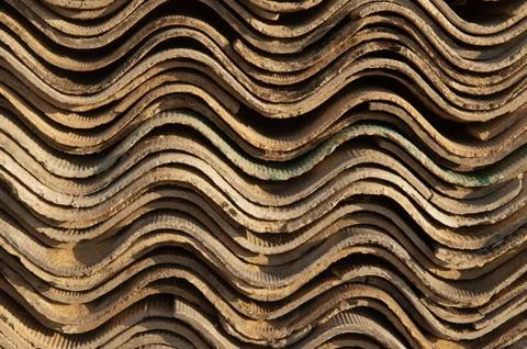 A stack of slate sheets for roofing. wavy end of slate sheets Photos